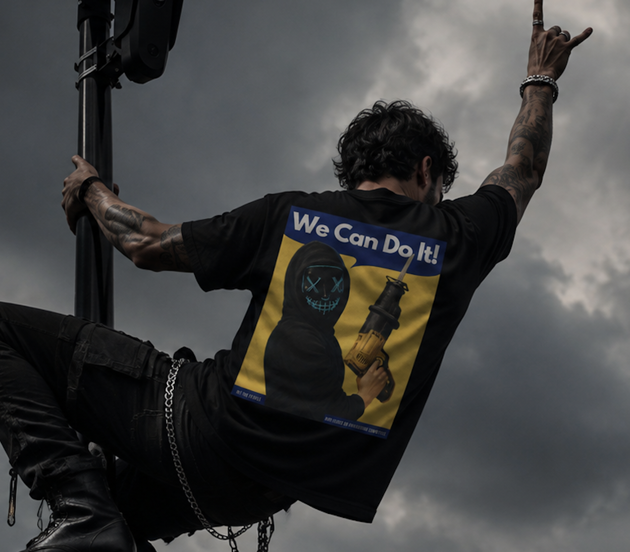 Person in a printed black tee climbing a surveillance camera pole under storm clouds